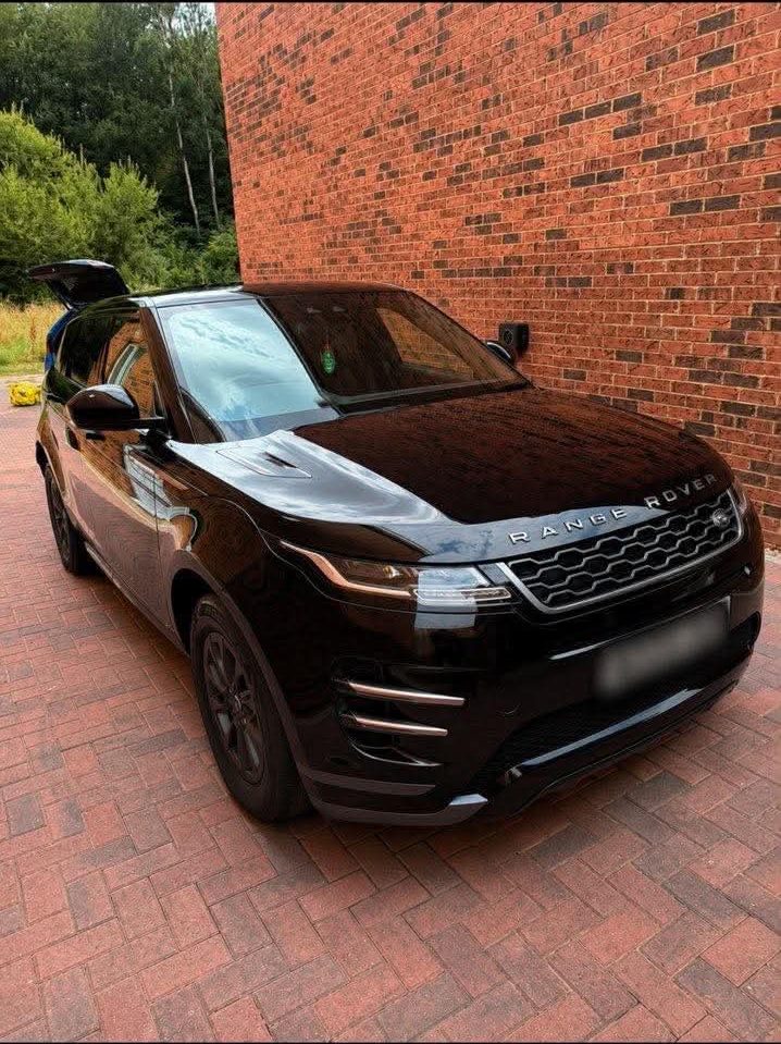 Black Range Rover Evoque after a full valet, glossy front three-quarter view